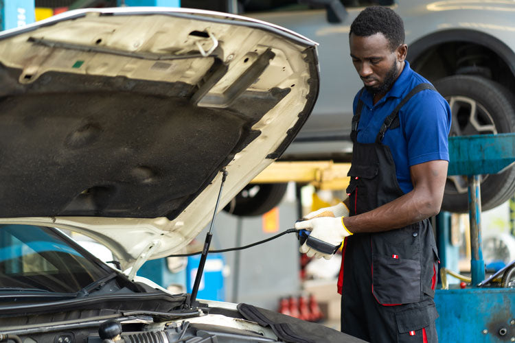 Man working on a car's ECM